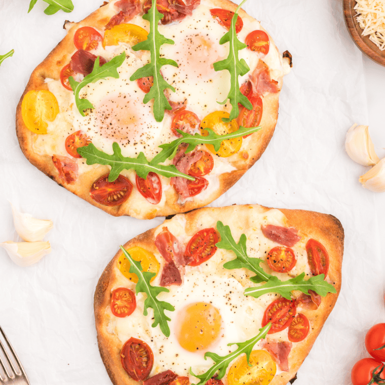 To achieve the perfect Breakfast Flatbread Pizza in your air fryer, here are some pro tips to consider:

Preheat the Air Fryer: Always preheat your air fryer before cooking to ensure even cooking and optimal results. This helps create a crispier crust and evenly melted cheese.

Use Parchment Paper: To prevent sticking and ensure easy removal, place a piece of parchment paper in the air fryer basket or on the tray before placing the flatbread.

Precook Ingredients: For ingredients like breakfast meats, such as bacon or sausage, it's a good idea to precook them slightly before adding them to the flatbread. This prevents the pizza from becoming too greasy as it cooks.

Avoid Overloading: While toppings are delicious, avoid overloading the flatbread with too many ingredients. A balanced amount of toppings ensures even cooking and a crispy crust.

Add Cheese First: Start with a layer of cheese on the bottom. This creates a barrier between the crust and wetter ingredients, helping to prevent sogginess.

Keep Eggs Moist: When adding scrambled eggs, make sure they are slightly undercooked since they will continue to cook during the air frying process.

Layer Ingredients Evenly: Distribute toppings evenly across the flatbread to ensure that each bite is flavorful.

Monitor Cooking Time: Keep a close eye on the cooking process. Cooking times may vary based on the thickness of the crust and the air fryer's temperature.

Don't Overcook: Avoid overcooking the flatbread pizza, as it can lead to a dry crust and overly crispy toppings.

Add Fresh Toppings Later: If you're adding fresh toppings like avocado or herbs, consider adding them after the pizza is cooked to preserve their texture and flavor.

Slice Before Serving: Allow the pizza to cool slightly before slicing. This helps maintain the toppings' arrangement and prevents them from sliding off.

Experiment with Settings: Air fryers vary in temperature and cooking times, so don't hesitate to experiment with settings to achieve your preferred level of crispiness.

By following these pro tips, you'll be able to create a mouthwatering and perfectly cooked Breakfast Flatbread Pizza in your air fryer. Enjoy the fusion of breakfast and pizza flavors with a crispy, golden crust!