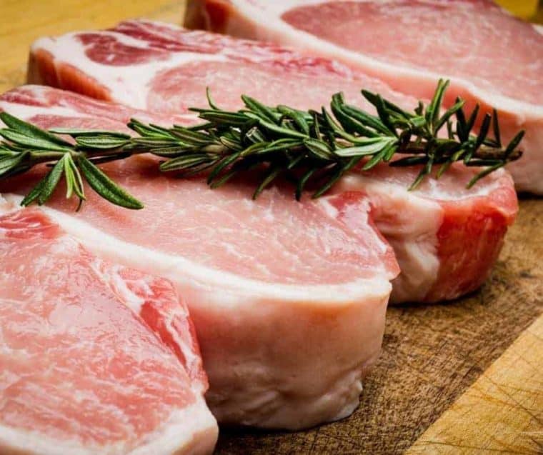 close up of raw pork chops for air fryer fried pork chops. 