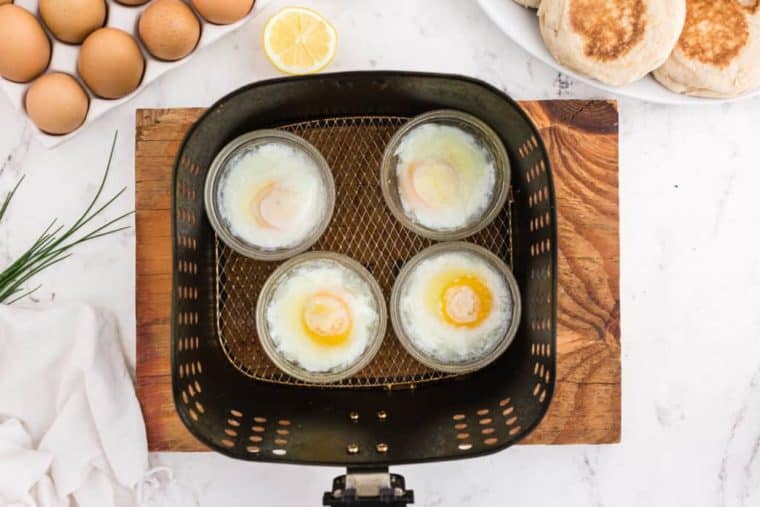 Top view of cooked poached egg in air fryer.