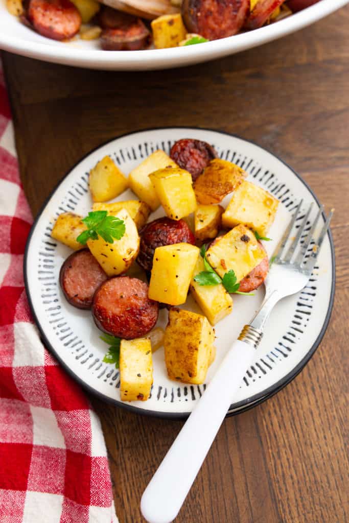 Top view of cooked air fryer sausage and potatoes. 