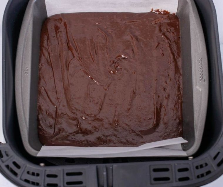 Batter from boxed brownies in a baking pan. 
