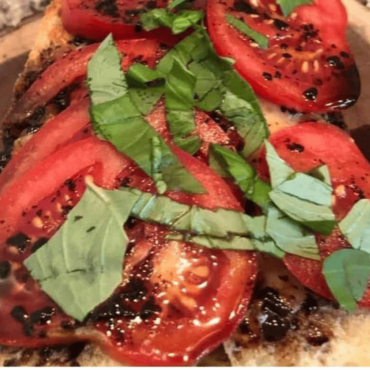 Caprese bread on cutting board.