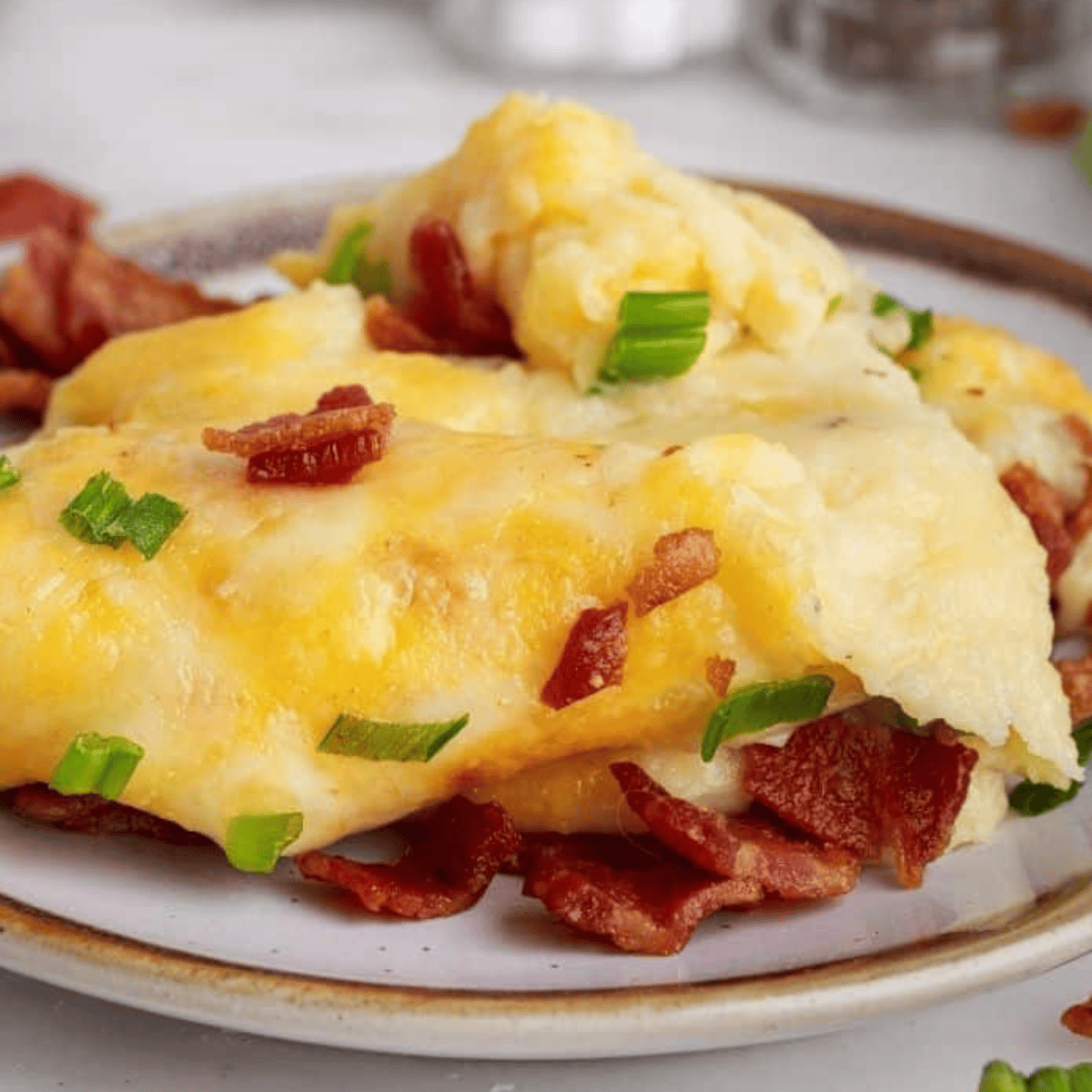 Creamy mashed potatoes with butter next to meatloaf slices