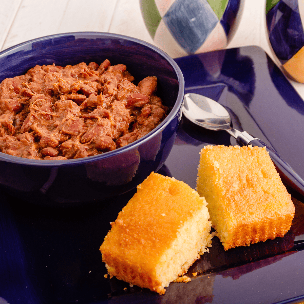 Cornbread and chili on plate.