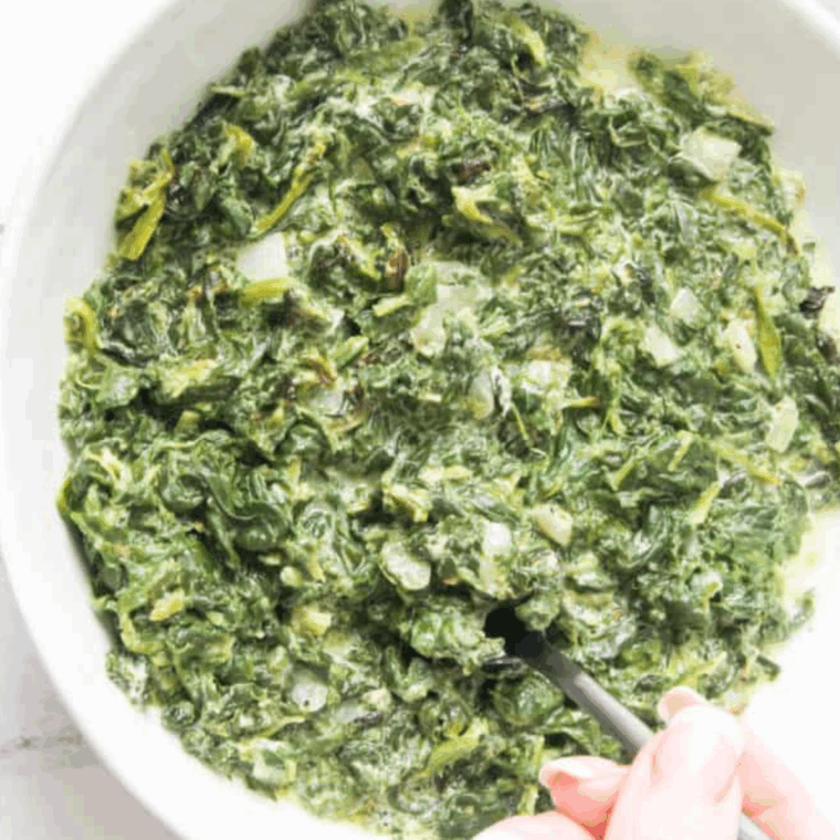 Creamed spinach served alongside meatloaf