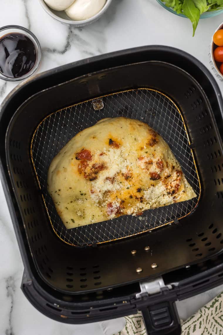 To achieve the perfect balance of crispy and gooey, follow these simple steps to cook Air Fryer Trader Joe's Burrata Focaccia to perfection:

Ingredients: