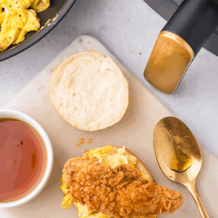 A stack of tall, golden-brown homemade Bojangles biscuits brushed with melted butter.