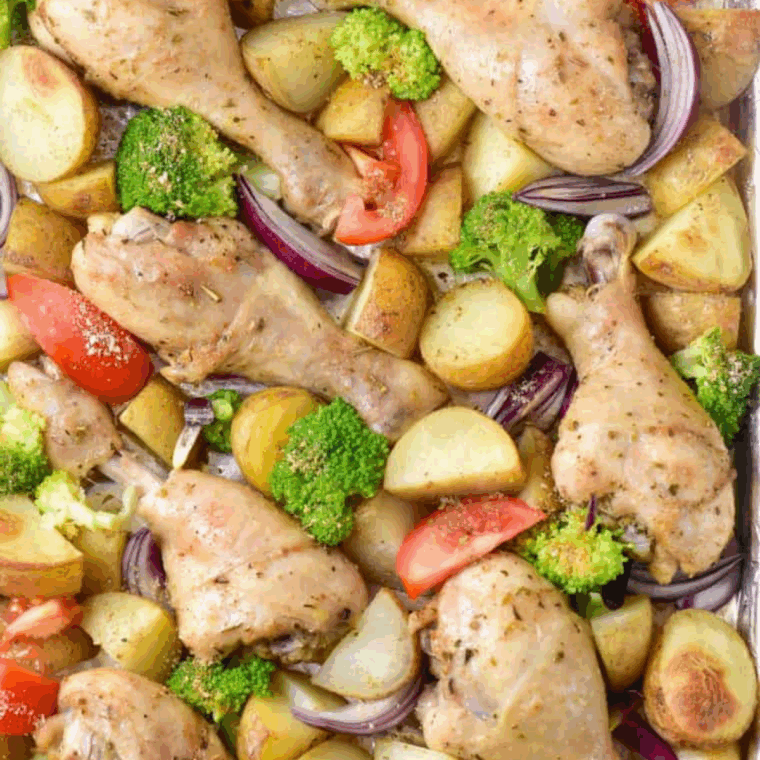 Plate of Juicy air fryer chicken drumsticks paired with crisp-tender vegetables. Quick, easy, and flavorful one-pan meal perfect for weeknights.