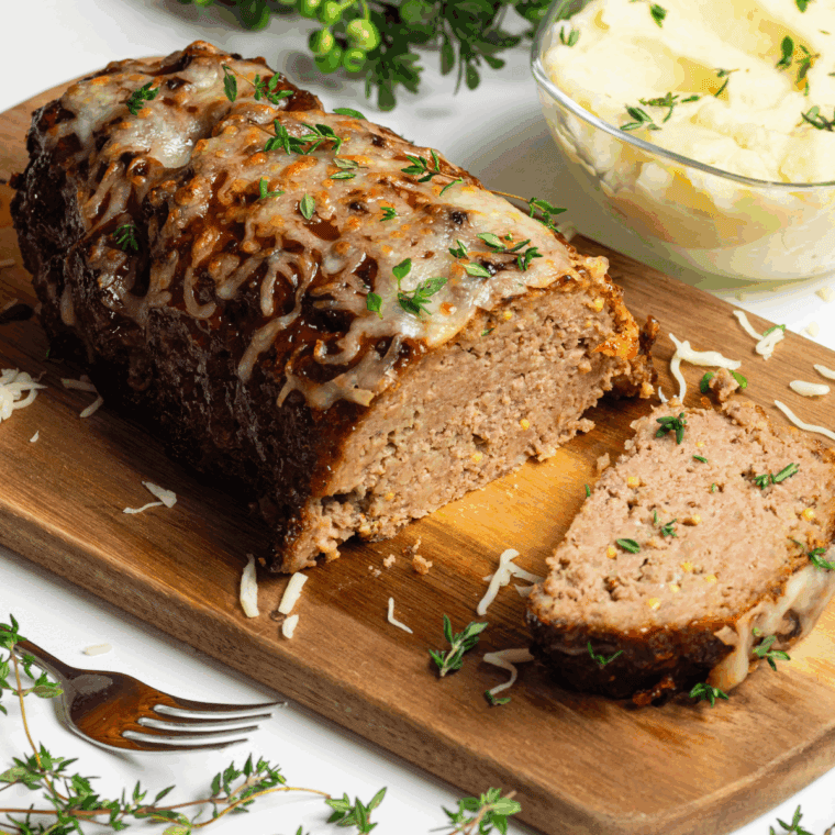 Sliced meatloaf reheated in air fryer with juicy center and crisp edges.