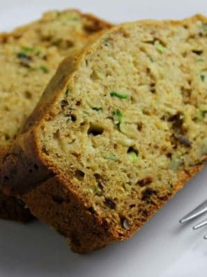 zucchini bread slices on plate with fork