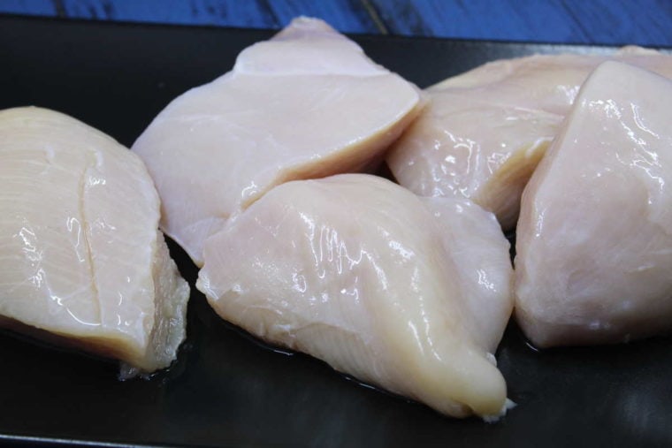 large chicken breasts sliced in half