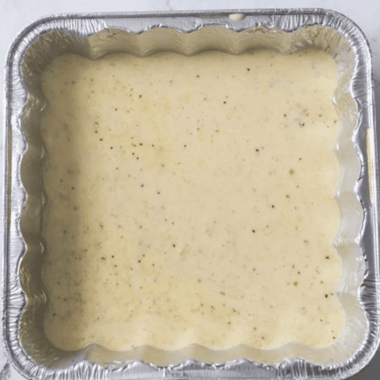 Cheese sauce mixture placed in an air fryer at 300°F, cooking until bubbly and smooth.