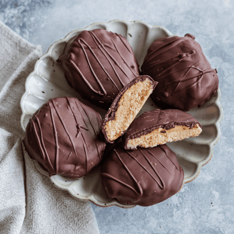 Freshly made Air Fryer Girl Scout Tagalongs cookies with peanut butter and chocolate, cooling on a wire rack.