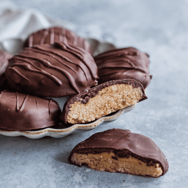 Homemade Tagalong cookies made in the air fryer, topped with peanut butter and coated in chocolate.