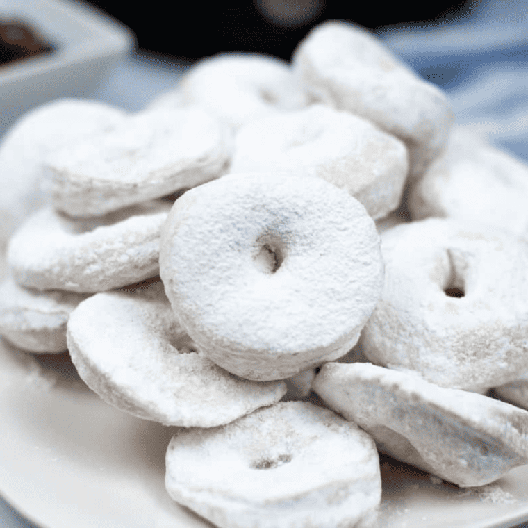 "Stacked Copycat Hostess Powdered Donettes with a sugary coating"