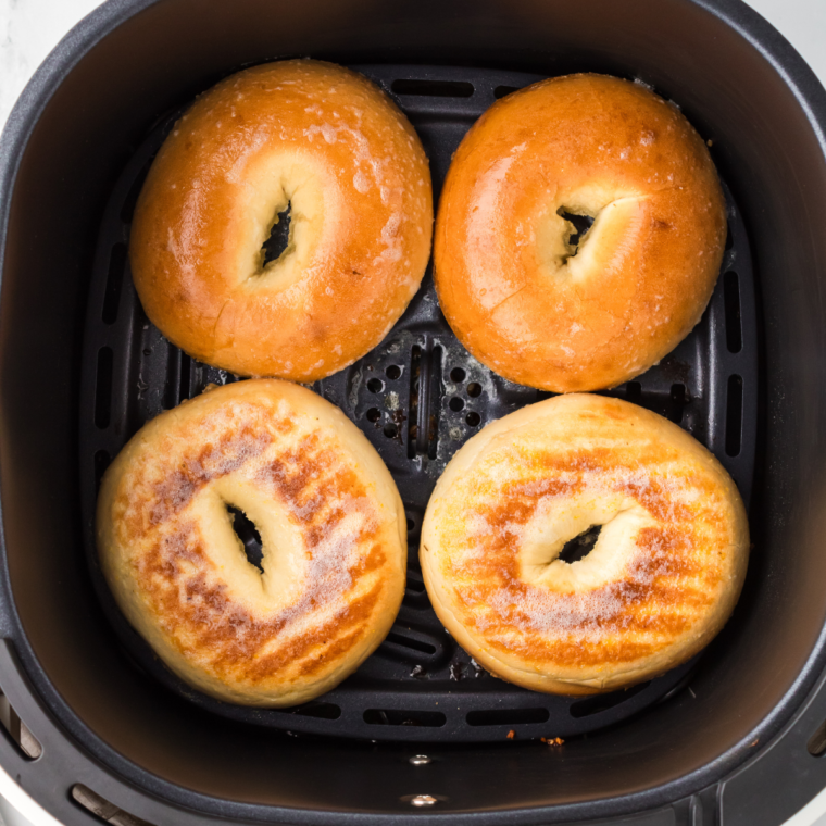 Toasting the bagel in the air fryer basket.