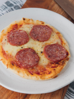 This air fryer pepperoni naan pizza cooks in 8 minutes flat using a 380&deg;F pre-crisp trick that keeps the bottom shatter-crisp instead of soggy. With six pantry ingredients and one piece of naan bread, you get a personal pizza that beats delivery &mdash; every single time.