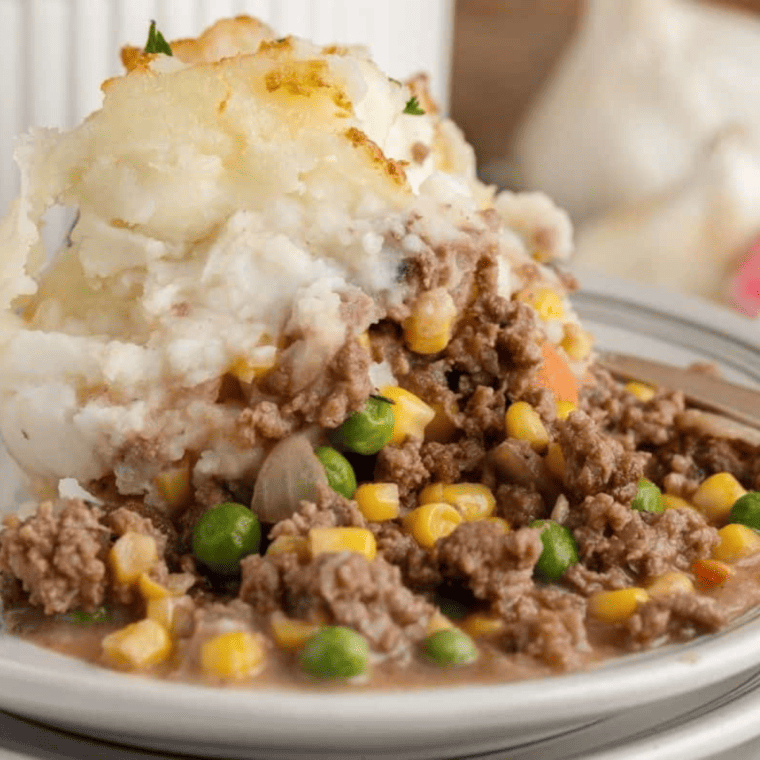 Air fryer shepherd&rsquo;s pie garnished with fresh parsley and ready to serve