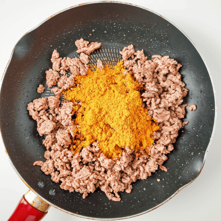Prepare the ground beef with taco seasoning in a large skillet.