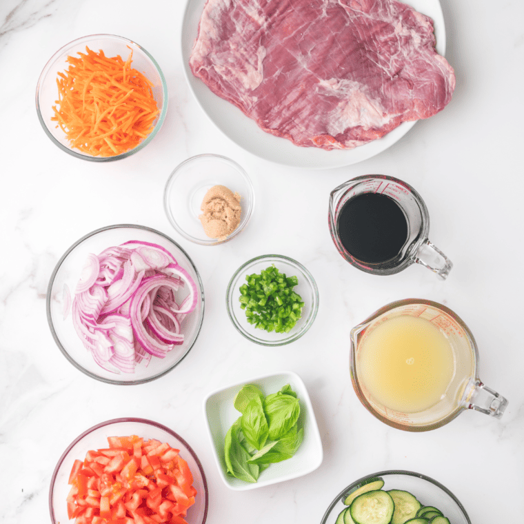 Ingredients needed for Air Fryer Thai Beef Salad on kitchen table.
