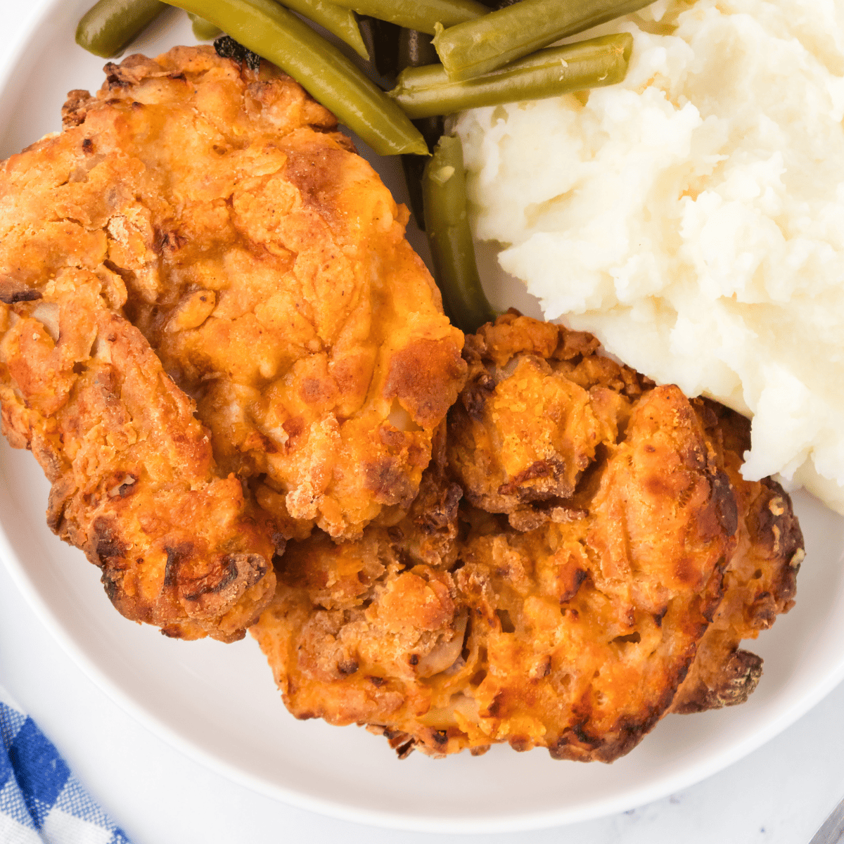 Here are some cooking tips to help you achieve the best results when making Copycat Air Fryer Cracker Barrel Southern Fried Chicken: Use the Right Chicken: Bone-in, skin-on chicken thighs are recommended for this recipe as they provide a perfect balance of flavor and juiciness. You can also use other cuts like drumsticks or chicken wings if you prefer. Marinate for Flavor: Don't rush the marinating process. Allowing the chicken to marinate in buttermilk with spices for at least 4 hours or overnight ensures that it's tender and flavorful. Preheat the Air Fryer: Ensure that your air fryer is fully preheated before adding the chicken. This helps achieve even cooking and crispy results. Don't Overcrowd: Avoid overcrowding the air fryer basket. Cook the chicken in batches if necessary to allow proper air circulation and ensure that each piece gets crispy. Flip the Chicken: Flipping the chicken halfway through the cooking time ensures even browning and crispiness on both sides. Use a Meat Thermometer: To ensure that the chicken is cooked to perfection and safe to eat, use a meat thermometer to check for an internal temperature of 165°F (74°C). Customize the Seasonings: Feel free to adjust the seasonings and spices in the coating mixture to suit your taste preferences. Experiment with different herbs and spices for unique flavors. Fresh Herbs: Adding fresh rosemary and thyme to the air fryer during cooking can infuse the chicken with aromatic flavors. This step is optional but highly recommended. Rest Before Serving: Allow the cooked chicken to rest for a few minutes before serving. This helps the juices redistribute, ensuring that each bite is juicy and flavorful. Serve Hot: Fried chicken is best enjoyed when it's hot and crispy. Serve it with your favorite Southern sides for a complete meal. Safety First: Always follow safe food handling practices, such as washing hands, utensils, and surfaces, and ensuring that the chicken reaches a safe internal temperature. By following these tips, you can create a delicious batch of Air Fryer Cracker Barrel Southern Fried Chicken that's crispy on the outside and tender on the inside, just like the Southern classic.