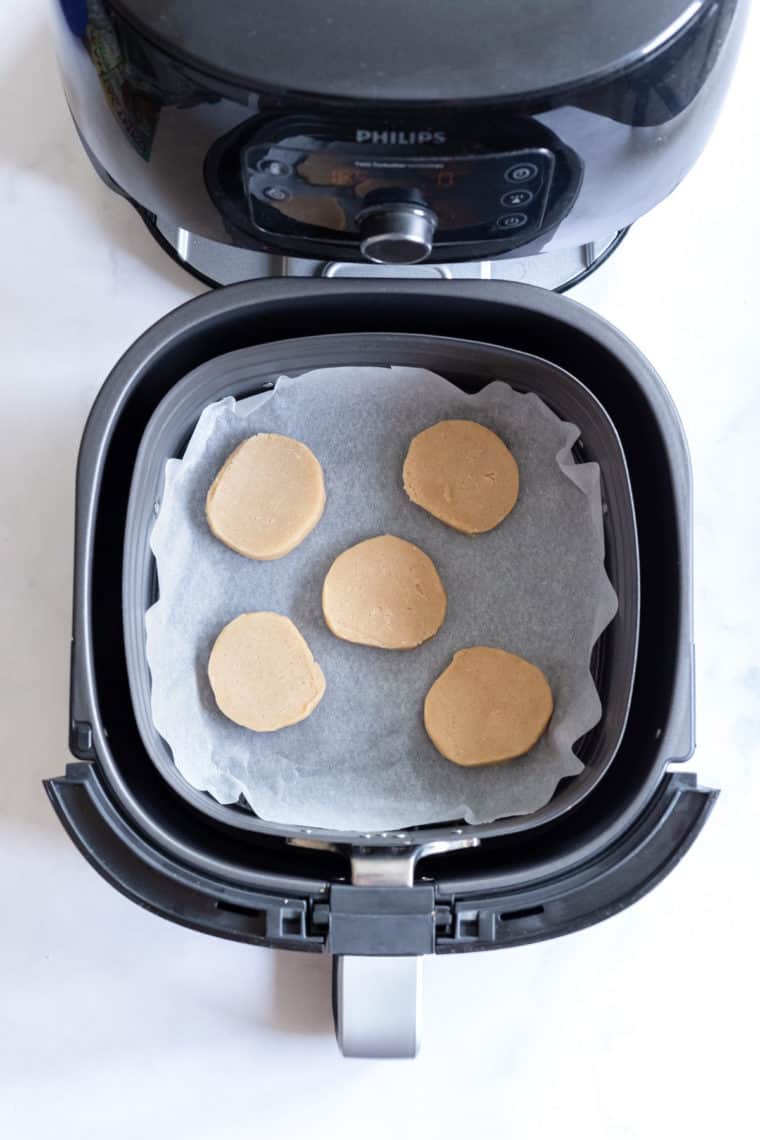 Place the cookie dough on top of the parchment paper.