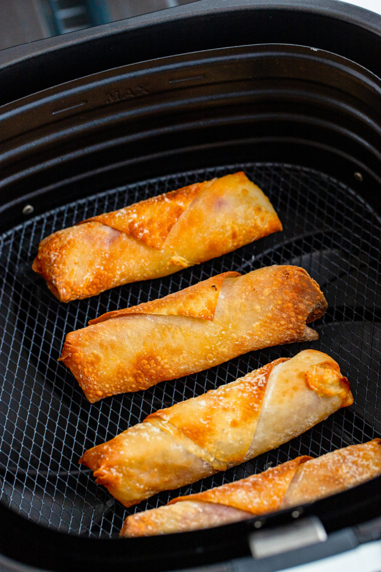 Crispy, golden Air Fryer Reuben Egg Rolls stuffed with corned beef, Swiss cheese, and sauerkraut.