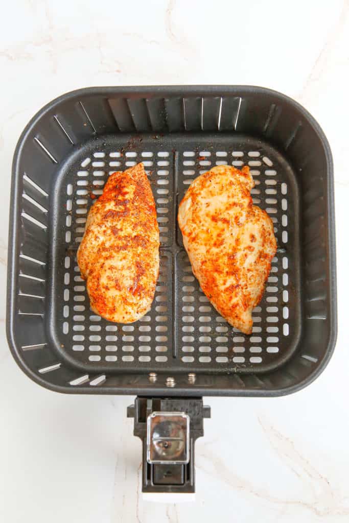 air fried chicken breasts in air fryer basket