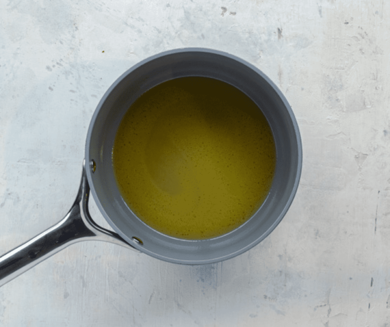 overhead: lemon butter sauce in small saucepan