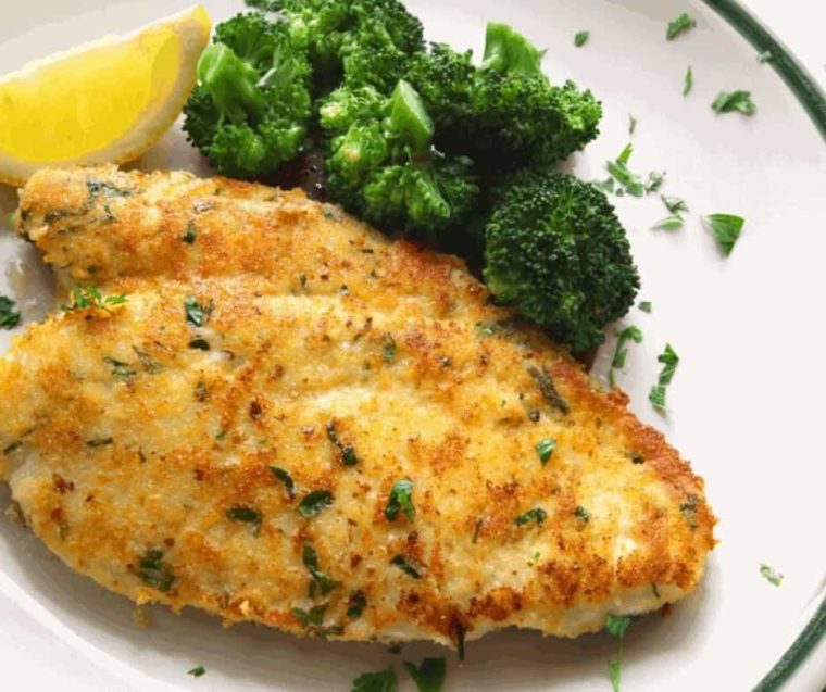 parmesan panko crusted chicken on a plate with steamed broccoli
