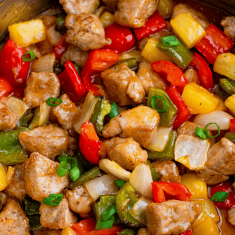 Air Fryer Peppers and Onions in a bowl with vibrant colors.