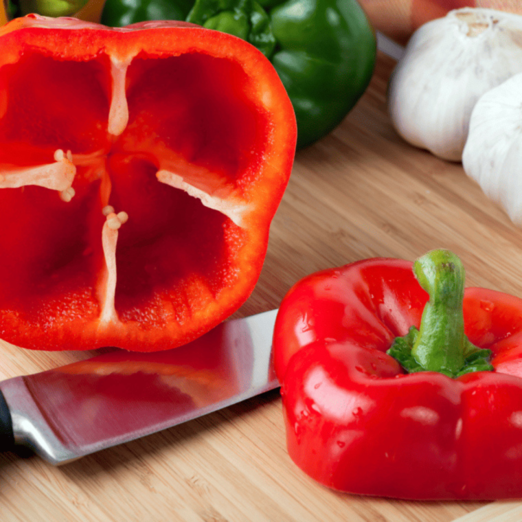 "Sliced bell peppers and red onions cooked in an air fryer."