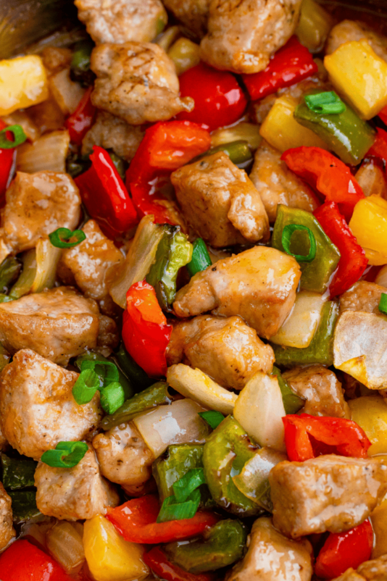 A colorful Air Fryer Pork Stir Fry featuring tender pork, vibrant bell peppers, carrots, and onions cooked to perfection.