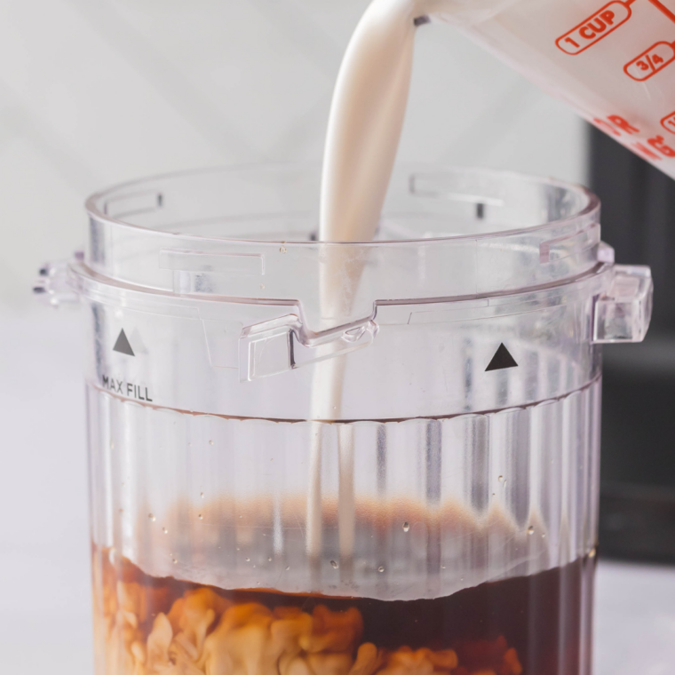 Peppermint syrup and chocolate sauce poured into the bottom of an empty glass mug