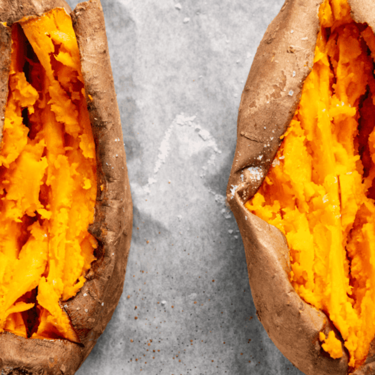 A cooked Ninja Foodi baked sweet potato, golden brown and fluffy on the inside, ready to be served.