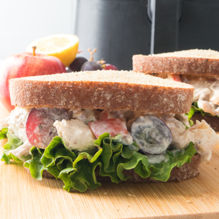 Close-up of Zoe's Chicken Salad garnished with herbs.