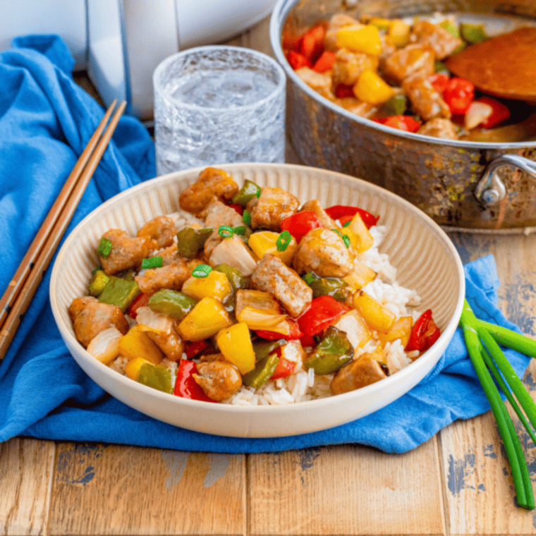 Air Fryer Pork Stir Fry with tender pork, bell peppers, and carrots cooked to perfection in the air fryer.