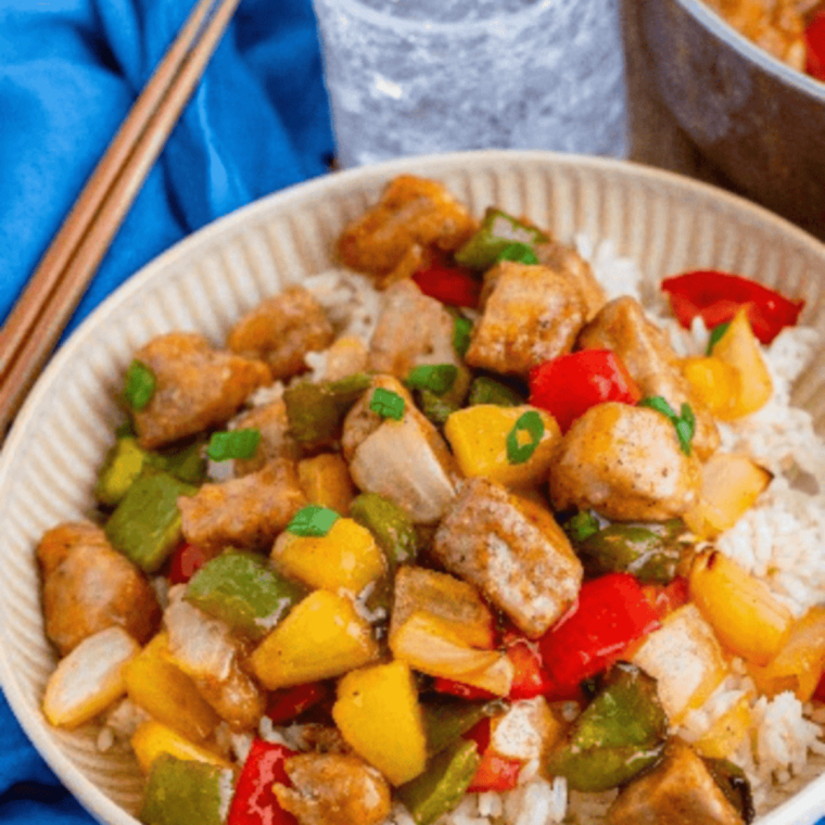 Air fryer pork stir fry with tender pork, colorful vegetables like bell peppers, carrots, and broccoli, cooked to perfection in the air fryer.