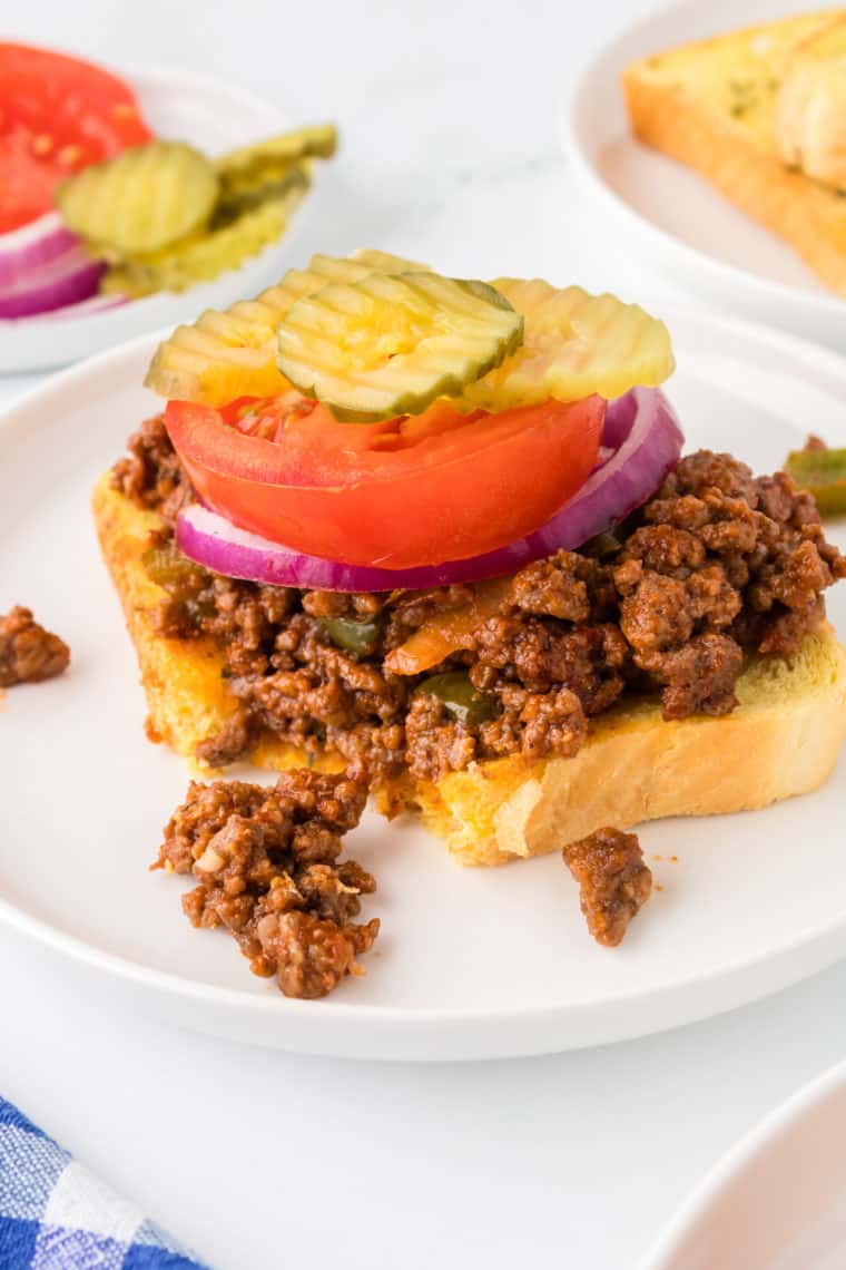 Open-Faced Sloppy Joes Wahlburger copycat with ground beef, melted cheese, and toasted bread.