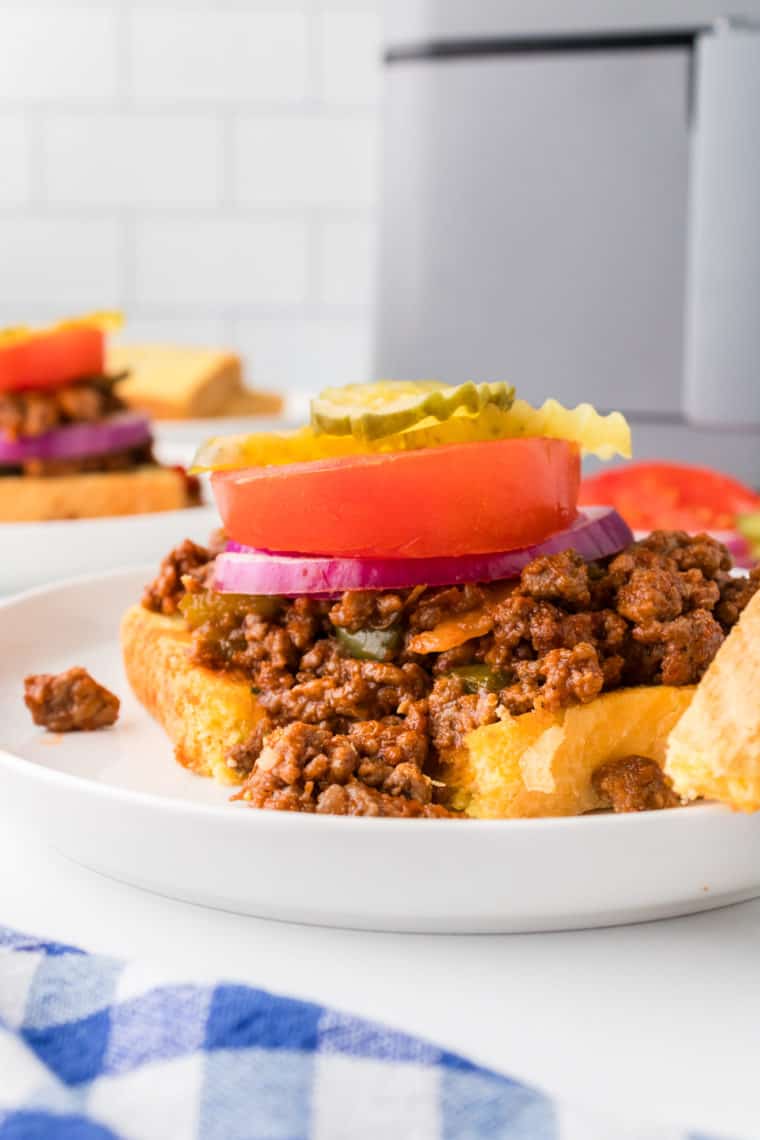 : Open-Faced Sloppy Joes Wahlburger copycat with savory ground beef, melted cheese, and crispy toasted bread.