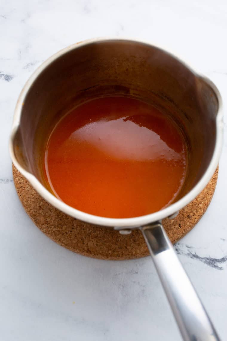 Combine Ingredients: In a medium-sized saucepan, whisk together the ketchup, Fireball Cinnamon Whisky, brown sugar, apple cider vinegar, Worcestershire sauce, mustard, garlic powder, and onion powder.

Simmer and Stir: Place the saucepan over medium heat and bring the mixture to a simmer while stirring constantly. This helps dissolve the brown sugar and ensures all the flavors meld together.

Reduce Heat: Once the sauce begins to simmer, reduce the heat to low to maintain a gentle simmer.

Simmer and Stir: Continue to simmer the sauce for about 15-20 minutes, stirring occasionally. This allows the sauce to thicken and intensify in flavor.

Taste and Adjust: Taste the sauce and adjust the seasonings if necessary. If you prefer a spicier sauce, you can add a dash more Fireball Whisky or a pinch of cayenne pepper.

Cool and Store: Remove the saucepan from the heat and let the Fireball BBQ Sauce cool to room temperature. Once cooled, transfer it to an airtight container or glass jar.

Store: Store the sauce in the refrigerator for up to a few weeks. The flavors will continue to meld and improve over time, making it even more delicious.

Now you have a batch of homemade Fireball BBQ Sauce ready to add a fiery kick to your grilled meats, burgers, ribs, or any dish that craves a sweet and spicy barbecue touch. Enjoy the bold and exciting flavors of this unique condiment!