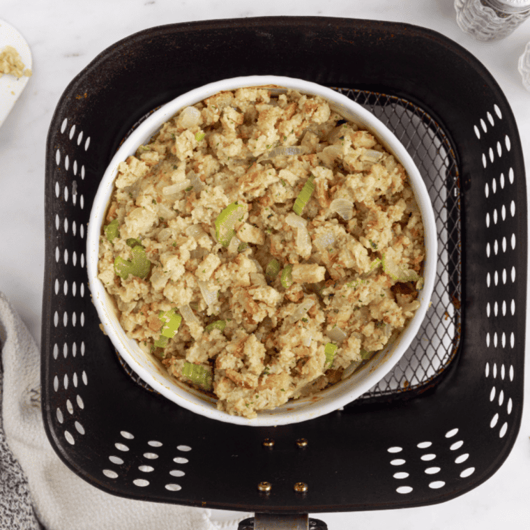 Casserole dish filled with chicken and stuffing ready to be placed in the air fryer.