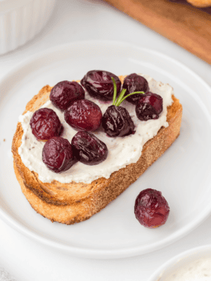 A bowl of perfectly caramelized air fryer grapes, glistening and ready to serve as a sweet and healthy treat.