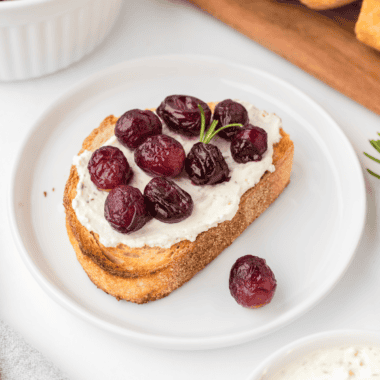 A bowl of perfectly caramelized air fryer grapes, glistening and ready to serve as a sweet and healthy treat.