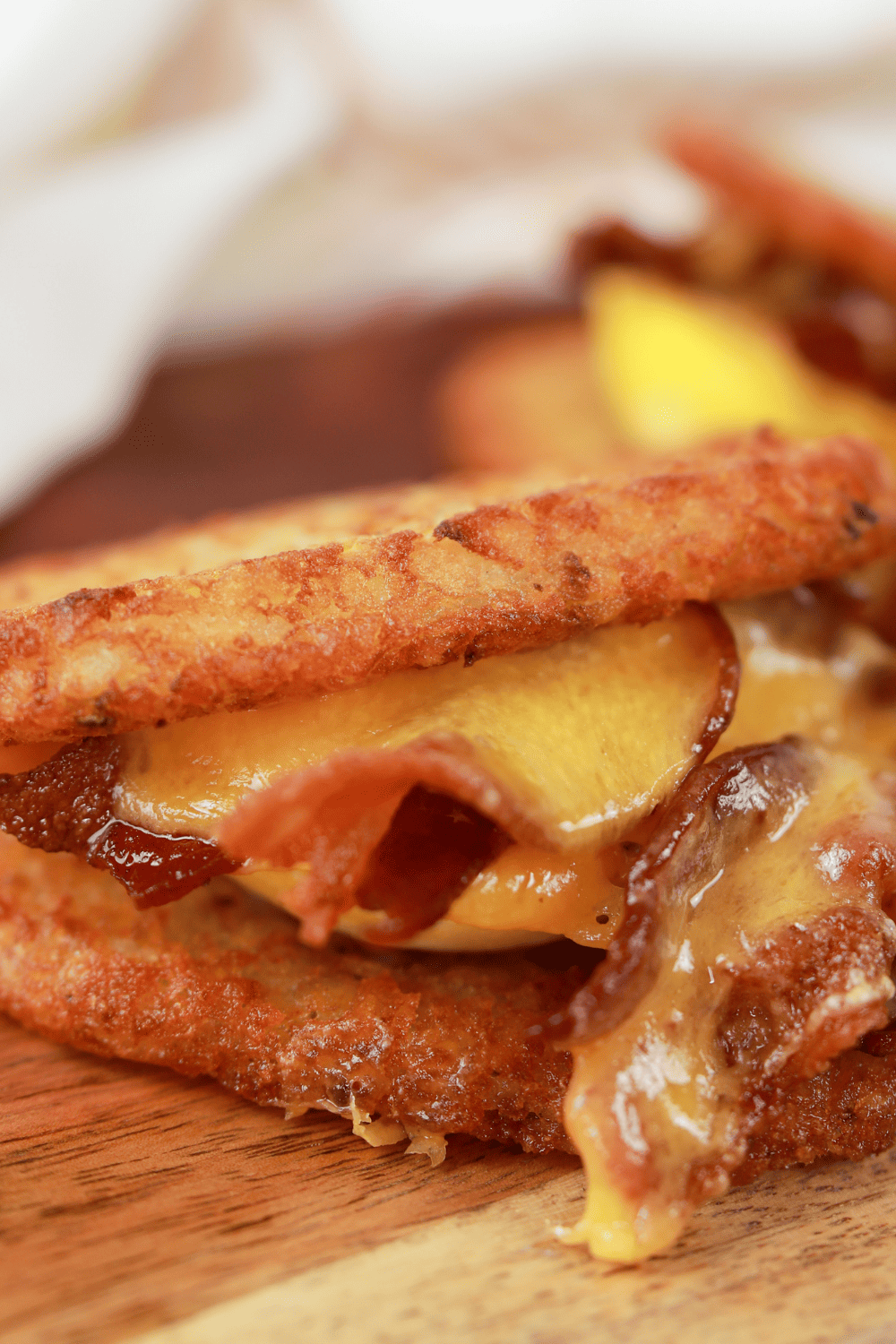 Baked egg sandwich with cheese and bacon.