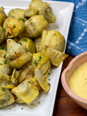 Canned artichoke hearts in the air fryer go from soft and watery to genuinely crispy in about 8 minutes &mdash; golden and craggy on the outside, tender and creamy in the middle. They're the kind of snack you make once and then keep a can in the pantry for permanently.