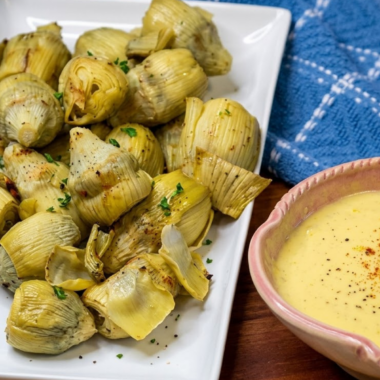 Canned artichoke hearts in the air fryer go from soft and watery to genuinely crispy in about 8 minutes &mdash; golden and craggy on the outside, tender and creamy in the middle. They're the kind of snack you make once and then keep a can in the pantry for permanently.