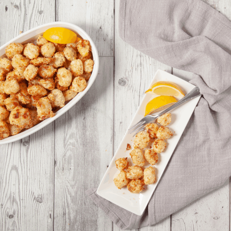 Plate of golden, Ritz cracker-coated air fryer scallops ready to serve