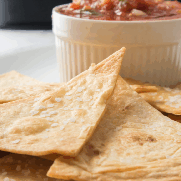 Golden crispy homemade Chili’s-style tortilla chips, perfect for dipping.