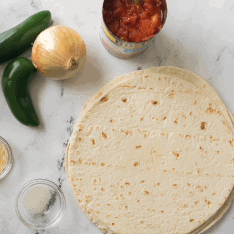 Ingredients needed for Chili’s Tortilla Chips Copycat Recipe on kitchen table.